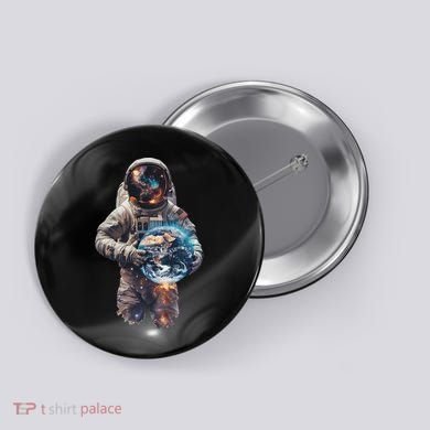 Astronaut Holds Earth In Space Button