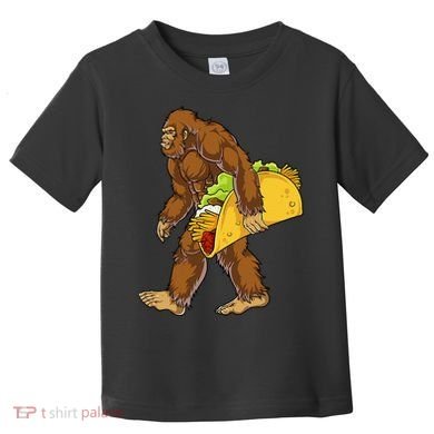 Bigfoot Carrying Taco Funny Cinco De Mayo Sasquatch Funny Toddler T-Shirt
