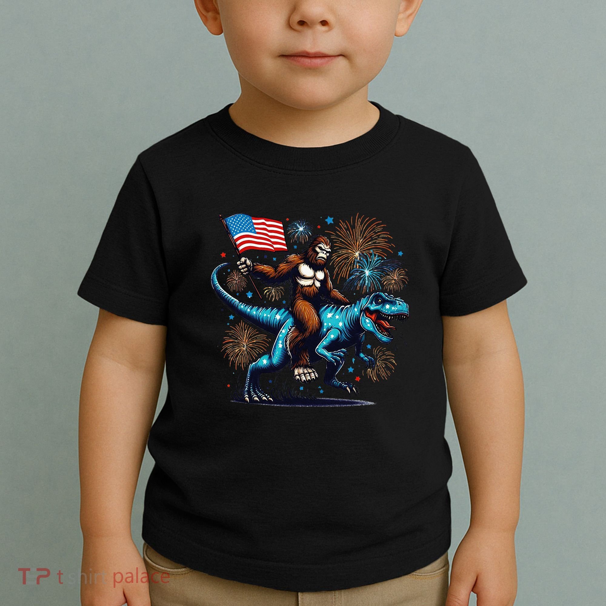 Bigfoot Fireworks Riding A Trex With Usa Flag Toddler T-Shirt