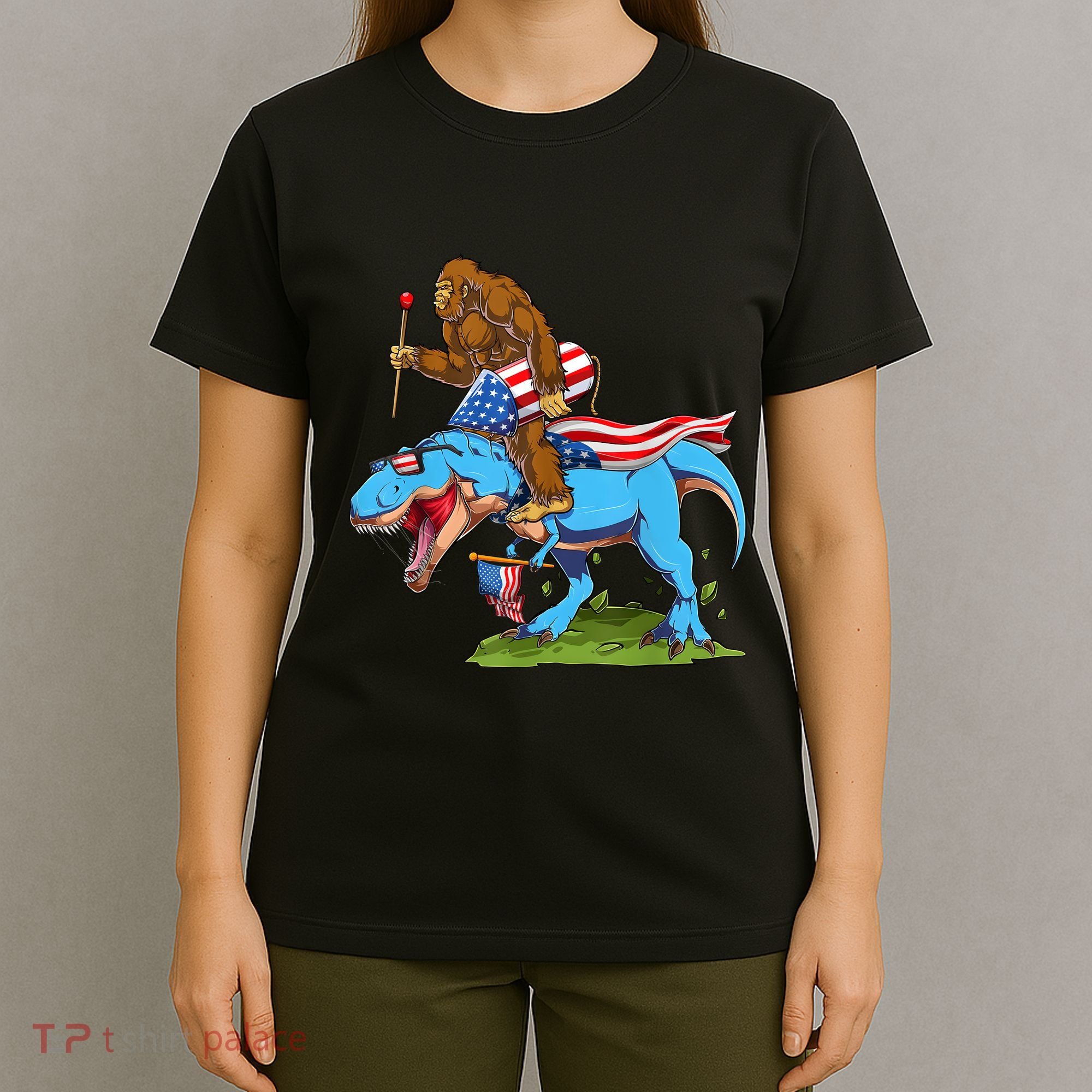 Bigfoot Riding Dinosaur USA Flag 4th Of July America T-Shirt