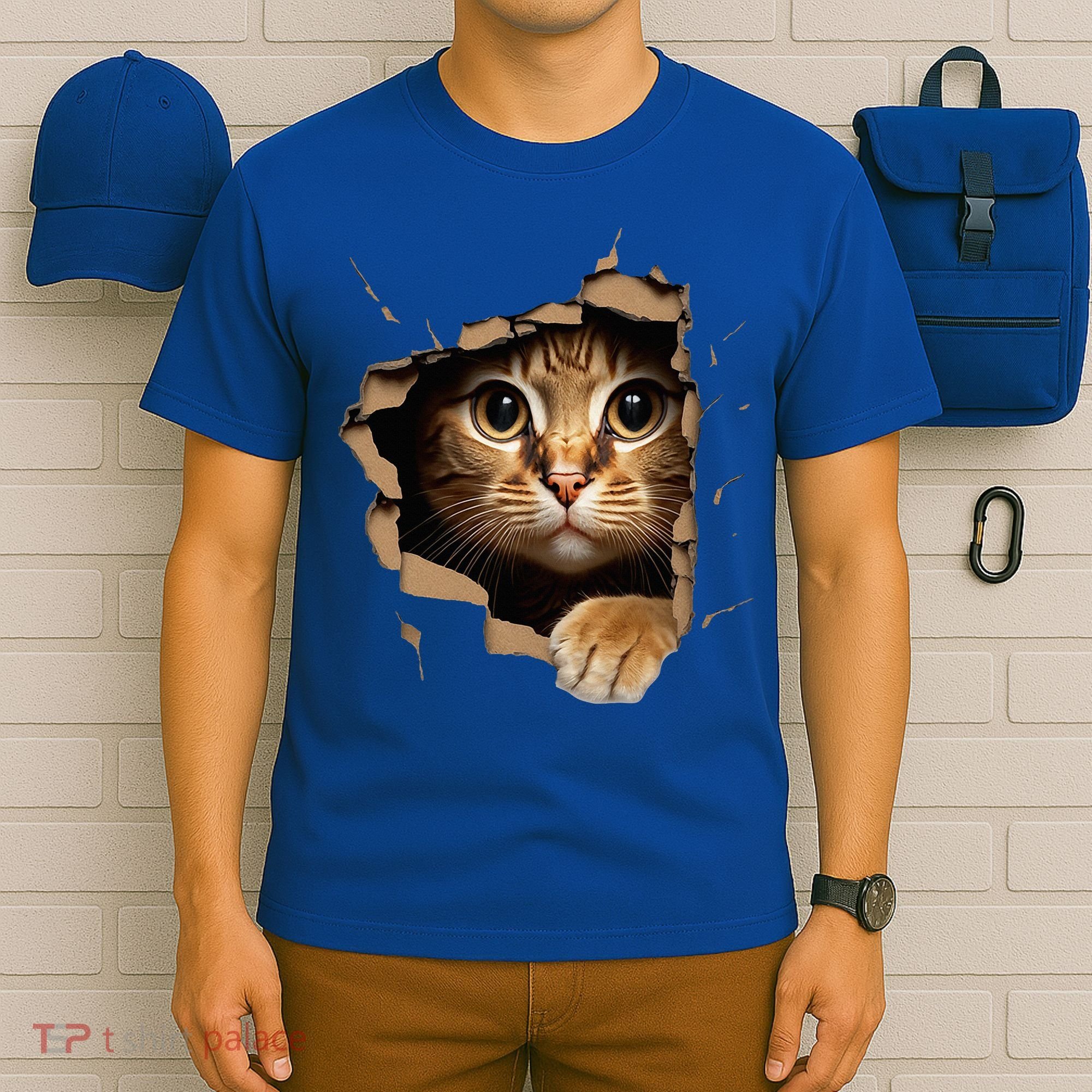 Cute kitten looks from torn fabric - Cats  T-Shirt