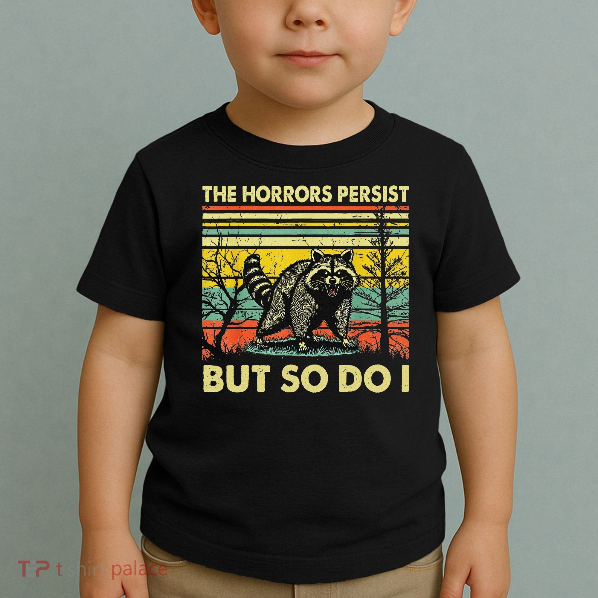 Funny The Horrors Persist But So Do Raccoon Meme Sarcastic Toddler T-Shirt