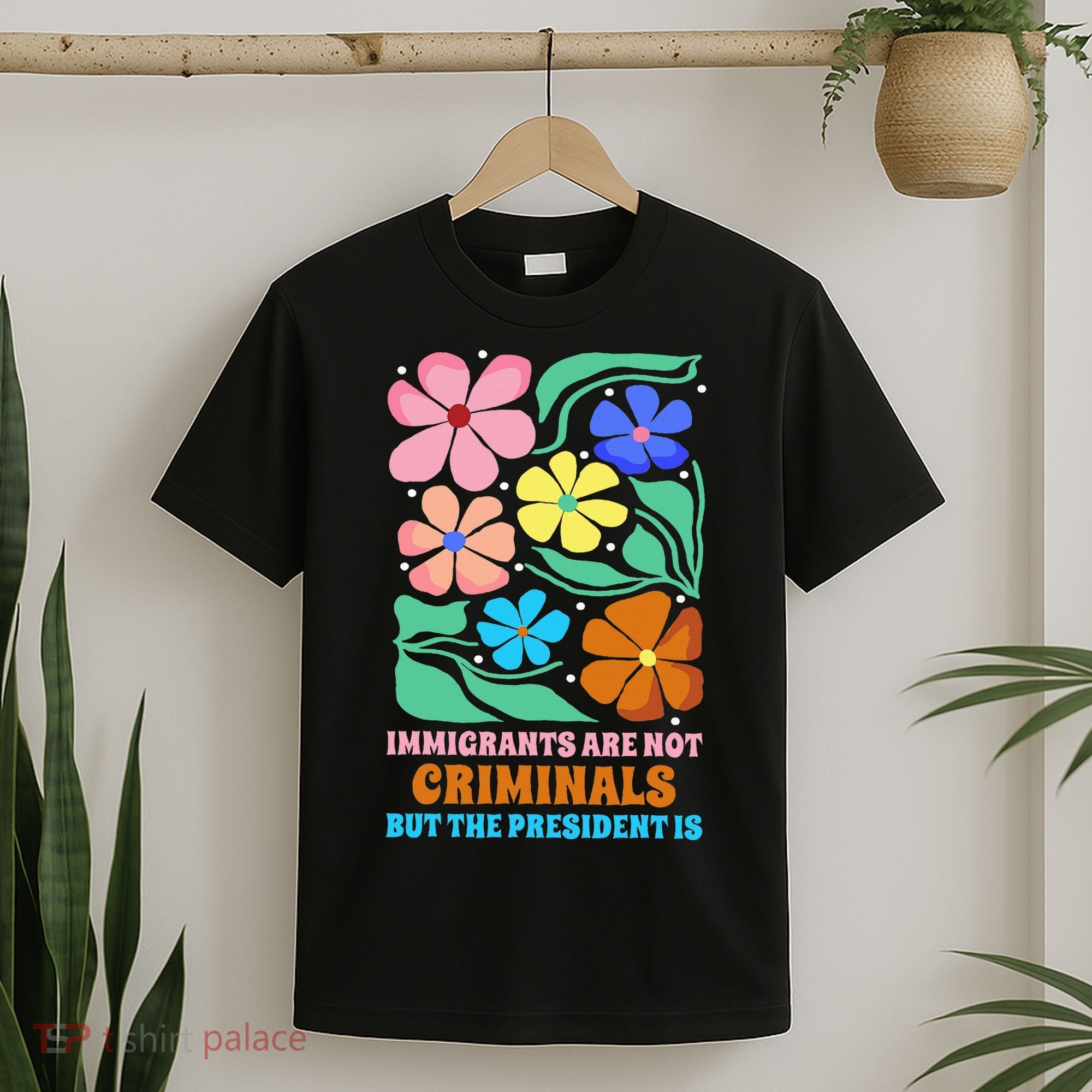 Immigrants Are Not Criminals But The President Is  T-Shirt