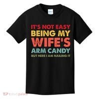 ItS Not Easy Being My WifeS Arm Candy Retro Funny Husband Kids T-Shirt thumb 0