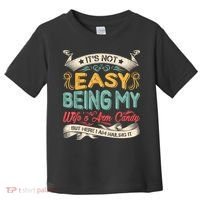 Its Not Easy Being My Wifes Arm Candy But Here I Am Nailin Toddler T-Shirt thumb 0