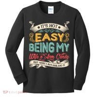 Its Not Easy Being My Wifes Arm Candy But Here I Am Nailin Kids Long Sleeve Shirt thumb 0