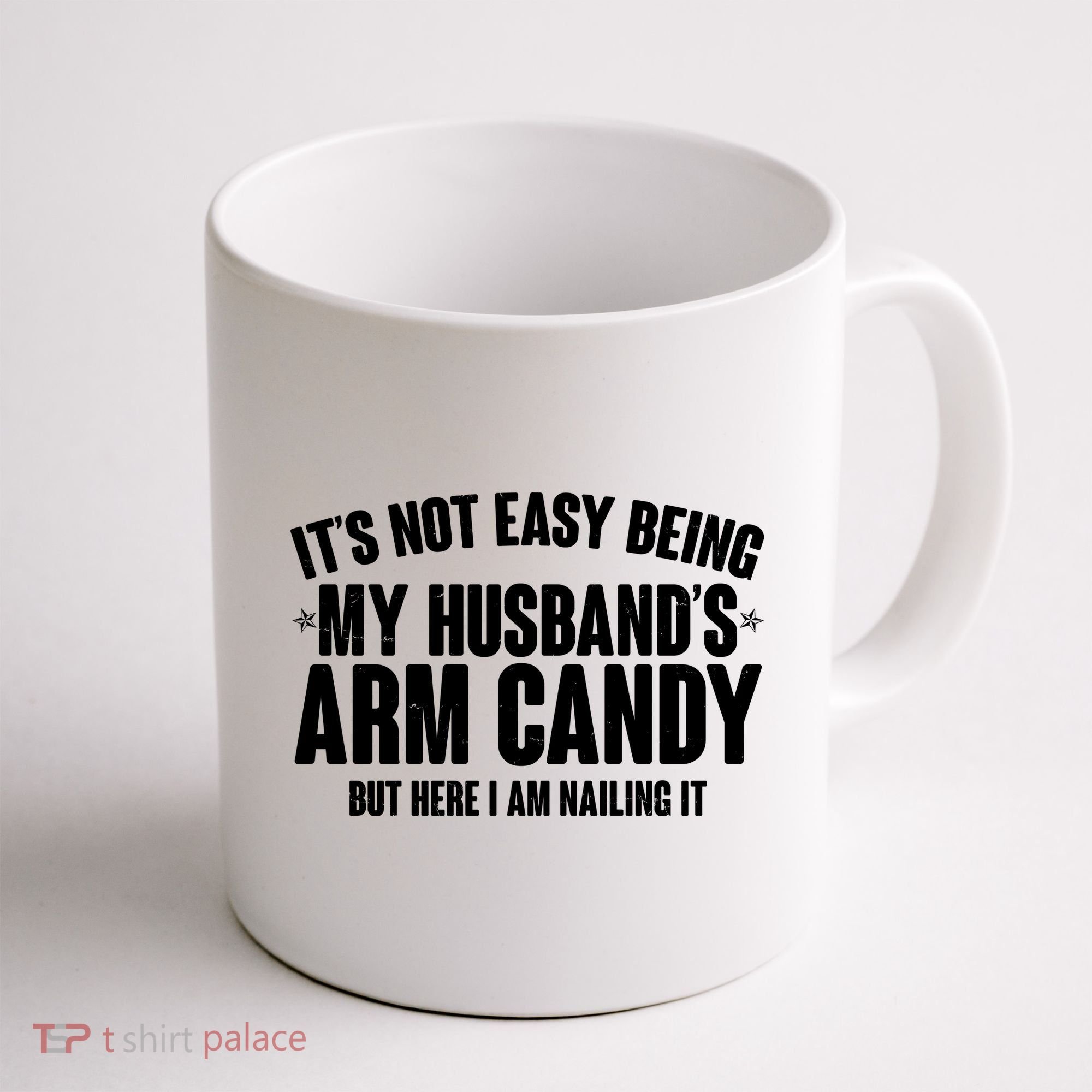 It's Not Easy Being My Husband's Arm Candy But Here I Am Nailing It Coffee Mug