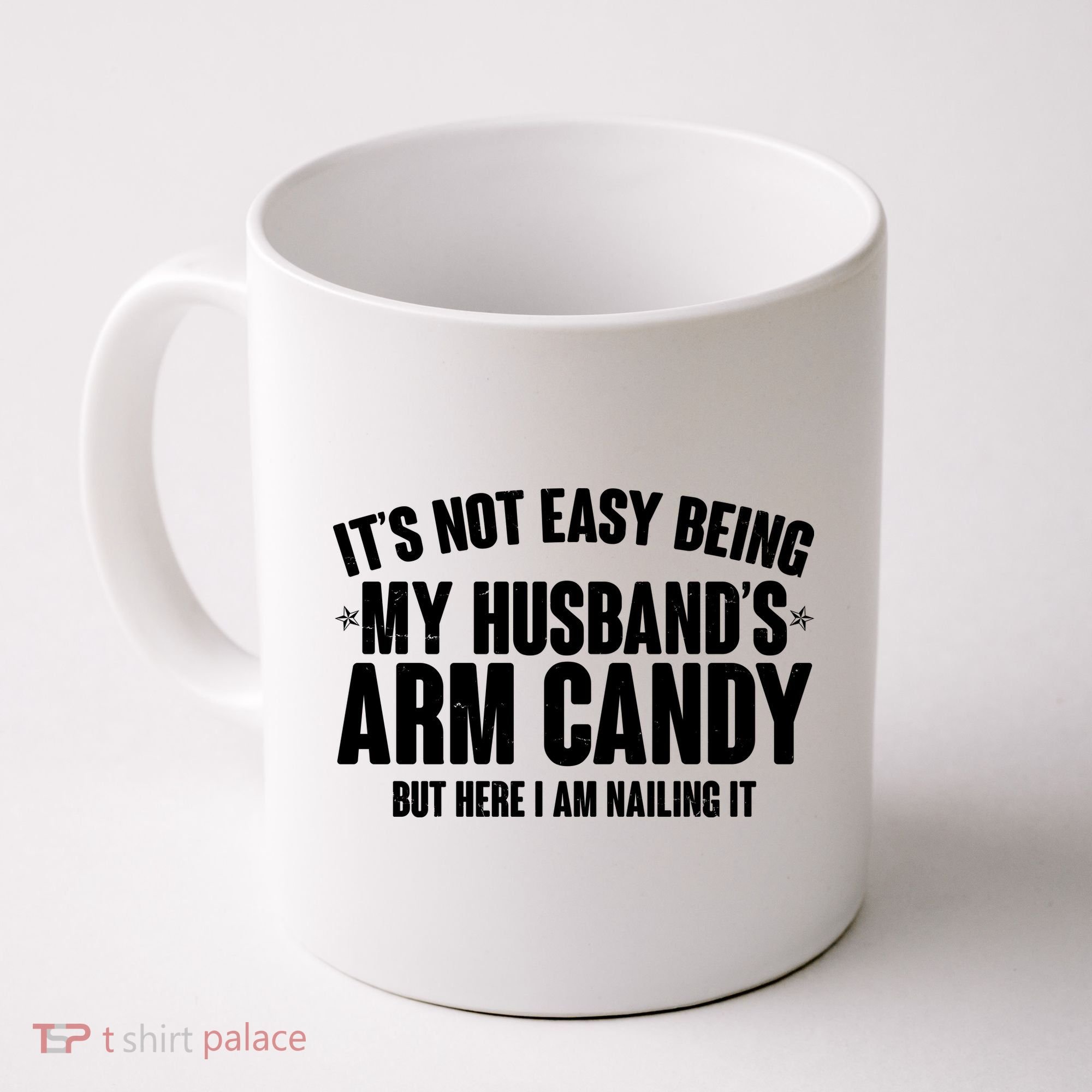 It's Not Easy Being My Husband's Arm Candy But Here I Am Nailing It Coffee Mug