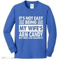 Its Not Easy Being My Wifes Arm Candy But Here I Am Nailing It Funny Kids Long Sleeve Shirt thumb 0
