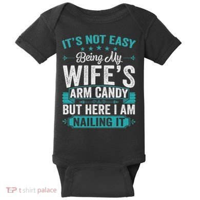 Its Not Easy Being My Wife's Arm Candy Funny Husband Baby Bodysuit