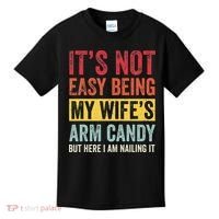 It's Not Easy Being My Wife's Arm Candy but here i am nailin Kids T-Shirt thumb 0