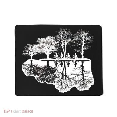 Kids Riding Bikes Through Trees Upside Down Mousepad