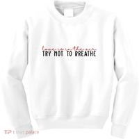 Love Is In The Air Try Not To Breathe Funny Valentine Kids Sweatshirt thumb 0