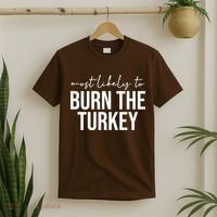 Most Likely To Burn The Turkey Funny Thanksgiving T-Shirt thumb 2