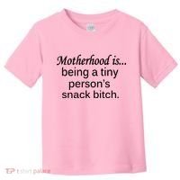 Motherhood Is Being A Tiny Person's Snack Toddler T-Shirt thumb 0
