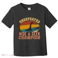 Nessie Undefeated Hide And Seek Champion Funny Nessie Toddler T-Shirt thumb 0