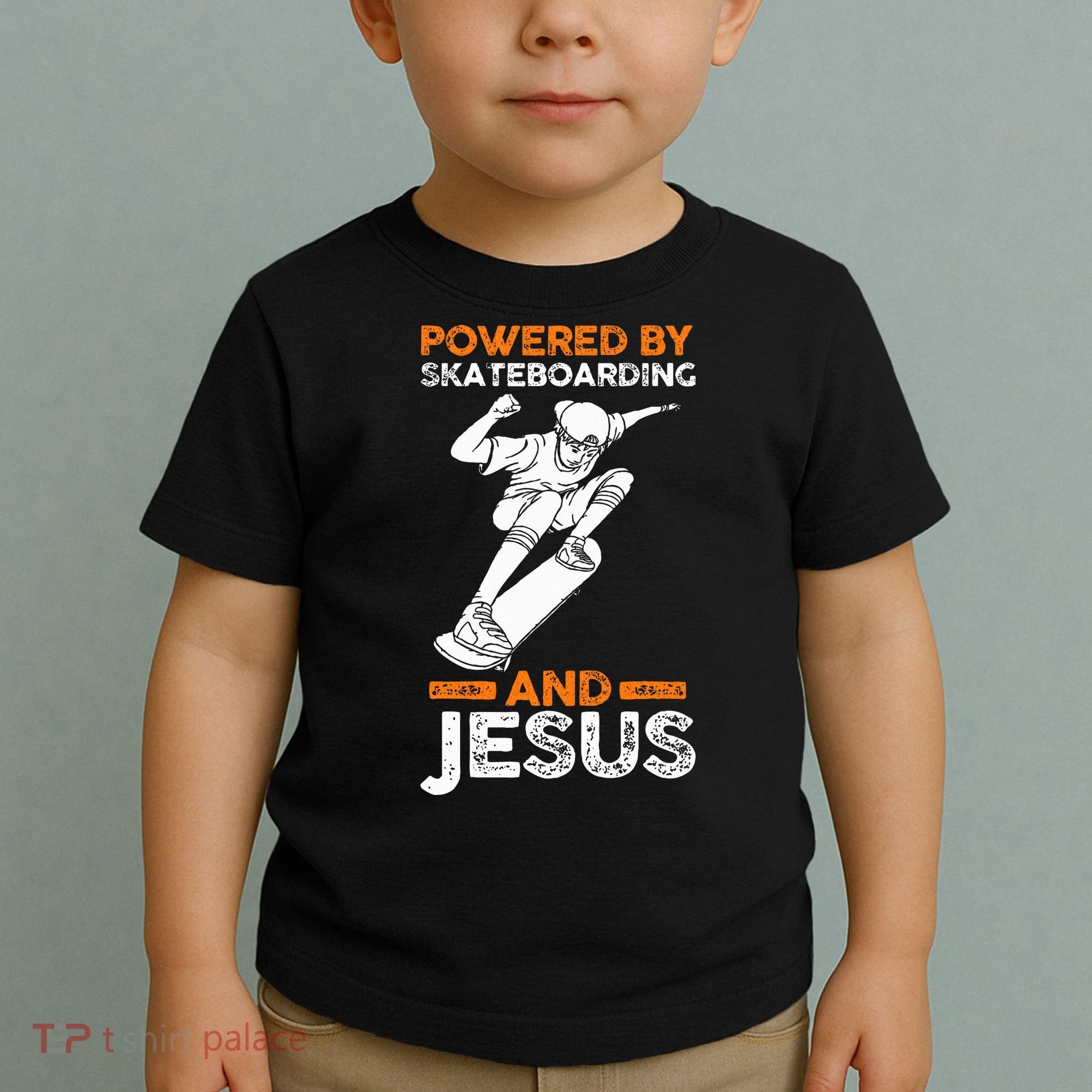 Powered by skateboarding and jesus Toddler T-Shirt