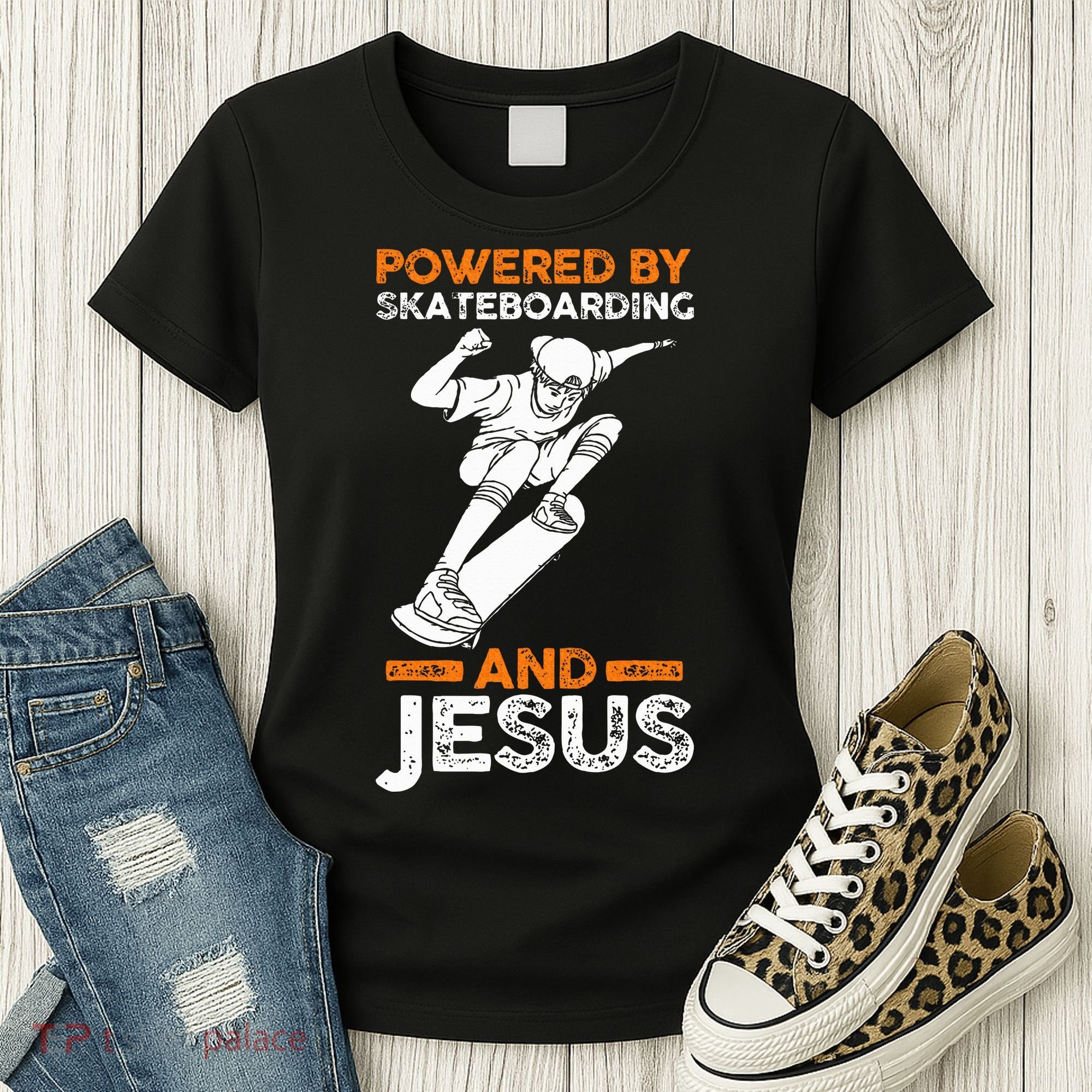 Powered by skateboarding and jesus Women's T-Shirt