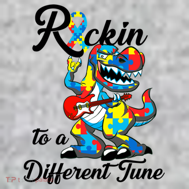 Rockin To A Different Tune Autism Dinosaur The Baniff Cuffed Pom Beanie