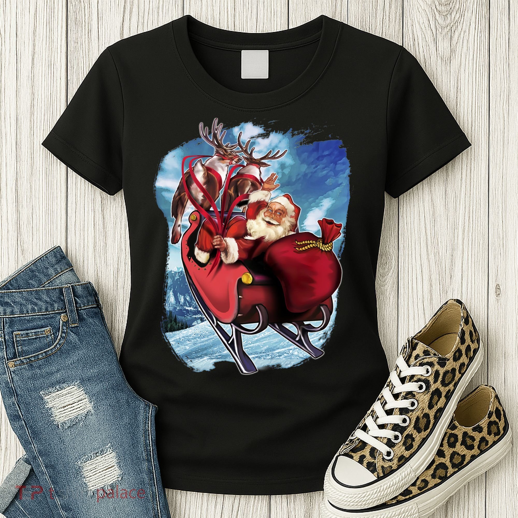 Santa Reindeer Sleigh Flying Over Snow Women's T-Shirt