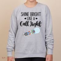 Shines Bright Like Call Light Funny Nurse Aide ER ICU Nurse Women's Sweatshirt thumb 0