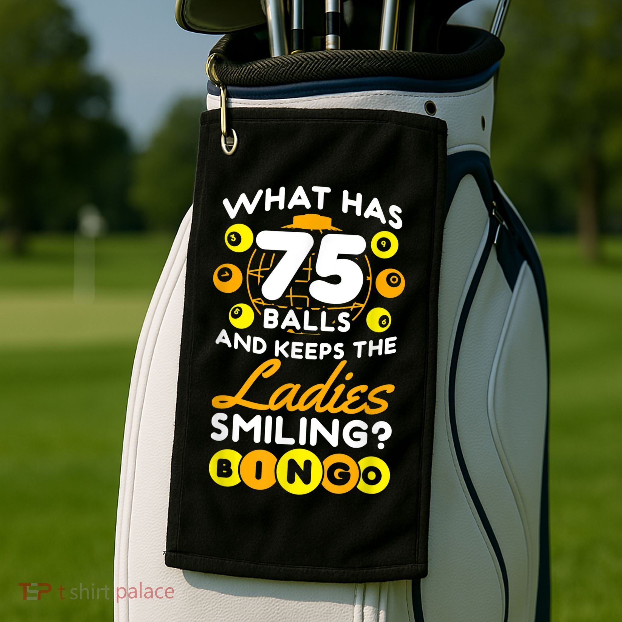 What Has 75 Balls And Keeps The Ladies Smiling Golf Towel