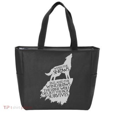 When The Snows Fall The Lone Wolf Dies, But the Pack Survives Tote Bag
